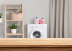 Wood table for display products on blurred laundry room photo