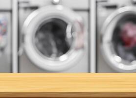 Wood table for display products on blurred laundry room photo