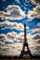 the Eiffel Tower is a metal tower completed in 1889 for the Universal Exhibition and then became the most famous monument in Paris. Here with the background of a cloudy sky photo