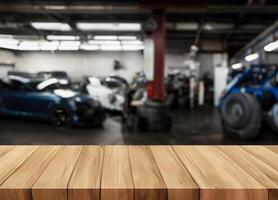 Wood table for product display in front of blurred factory garage photo