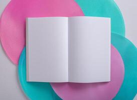 top view of white empty book on colorful color background photo