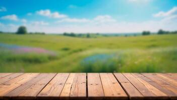 Wooden table top podium on blurred trees and green grass field with colorful wild flowers and blue sky. Product display, showcase, presentation. High quality photo. photo