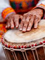 Closeup of hands playing traditional african drum. photo