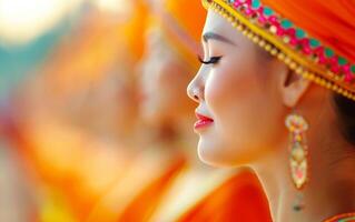 Woman in Orange Sari with Traditional Indian Jewelry. photo
