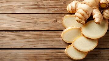 Fresh Organic Ginger Root Slices On Wooden Background. photo