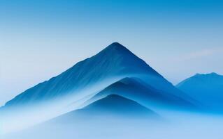 Misty Mountain Range Silhouette With Soft Blue Sky. photo