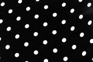Vintage polka dot textile background texture, white dots on black luxury fabric design pattern photo
