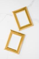 golden photo frame on marble, flatlay mockup - decor and mockup flatlay concept