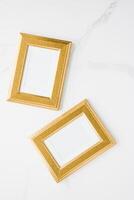golden photo frame on marble, flatlay mockup - decor and mockup flatlay concept