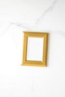 golden photo frame on marble, flatlay mockup - decor and mockup flatlay concept