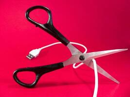 cutting wire with scissors - tech, internet, information and communication styled concept photo