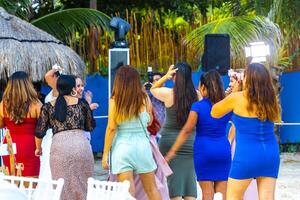 Playa del Carmen Quintana Roo Mexico 2023 Dancing bouquet toss and party at Mexican wedding reception Mexico. photo