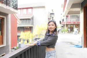 Asian women do freestyle hip hop and breakdancing in a public space in the middle of the city. With a cheerful and happy attitude photo
