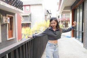 Asian women do freestyle hip hop and breakdancing in a public space in the middle of the city. With a cheerful and happy attitude photo