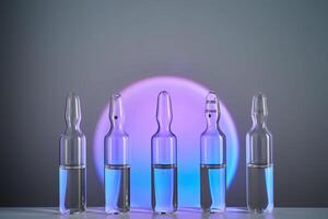 Several ampoules for injection with medicines on a purple background. photo