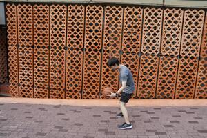 Men take a walk to relax after playing basketball in a public area, having fun and practicing at the same time. photo