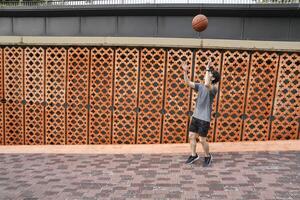 Men take a walk to relax after playing basketball in a public area, having fun and practicing at the same time. photo