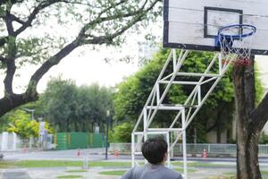 Men take a walk to relax after playing basketball in a public area, having fun and practicing at the same time. photo