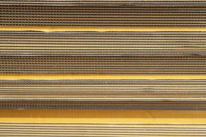 Cardboard, texture, background for graphics It is factory made cardboard waiting to be packed. photo