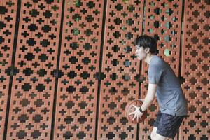 Men take a walk to relax after playing basketball in a public area, having fun and practicing at the same time. photo
