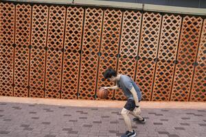 Men take a walk to relax after playing basketball in a public area, having fun and practicing at the same time. photo