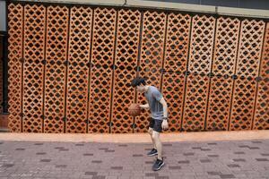 Men take a walk to relax after playing basketball in a public area, having fun and practicing at the same time. photo