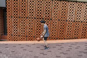 Men take a walk to relax after playing basketball in a public area, having fun and practicing at the same time. photo