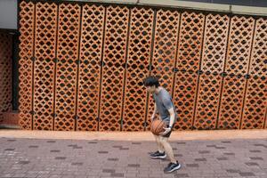 Men take a walk to relax after playing basketball in a public area, having fun and practicing at the same time. photo