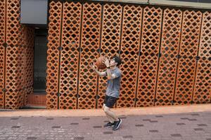 Men take a walk to relax after playing basketball in a public area, having fun and practicing at the same time. photo