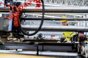 technician engineers checking the process on Heavy machine. mechanical engineering team production. Industry manufacturing. Worker holding tablet and folde. High technology production. photo