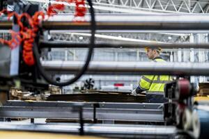 technician engineers checking the process on Heavy machine. mechanical engineering team production. Industry manufacturing. Worker holding tablet and folde. High technology production. photo