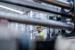 technician engineers checking the process on Heavy machine. mechanical engineering team production. Industry manufacturing. Worker holding tablet and folde. High technology production. photo