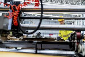 technician engineers checking the process on Heavy machine. mechanical engineering team production. Industry manufacturing. Worker holding tablet and folde. High technology production. photo