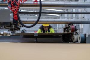 technician engineers checking the process on Heavy machine. mechanical engineering team production. Industry manufacturing. Worker holding tablet and folde. High technology production. photo