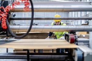 technician engineers checking the process on Heavy machine. mechanical engineering team production. Industry manufacturing. Worker holding tablet and folde. High technology production. photo