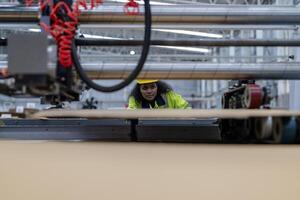 technician engineers checking the process on Heavy machine. mechanical engineering team production. Industry manufacturing. Worker holding tablet and folde. High technology production. photo