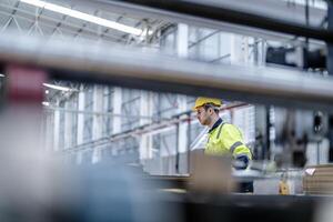 technician engineers checking the process on Heavy machine. mechanical engineering team production. Industry manufacturing. Worker holding tablet and folde. High technology production. photo