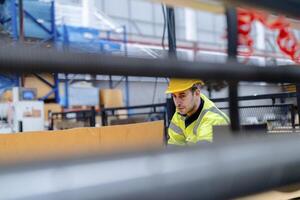 technician engineers checking the process on Heavy machine. mechanical engineering team production. Industry manufacturing. Worker holding tablet and folde. High technology production. photo