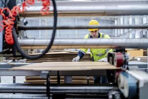 technician engineers checking the process on Heavy machine. mechanical engineering team production. Industry manufacturing. Worker holding tablet and folde. High technology production. photo