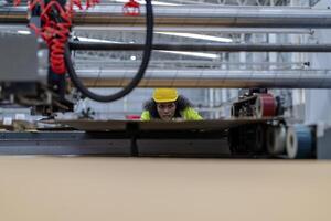technician engineers checking the process on Heavy machine. mechanical engineering team production. Industry manufacturing. Worker holding tablet and folde. High technology production. photo