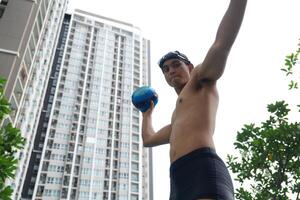 Asian men practicing swimming and preparing to play water polo and stretching and resting for water sports. photo