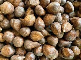 Close up view of snake fruit or salak, an exotic Indonesian fruit in the market photo