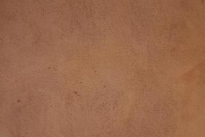 Rustic Red Cob Wall Texture Background Symbolizing Natural Earth Elements photo