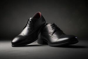Man, black oxfords shoe is sitting on a dark background photo