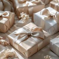 Beige Gift Boxes With Ivory Satin Ribbons Arranged on a Textured Surface photo