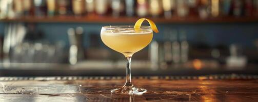 A Refreshing Cocktail on a Bar Counter With a Lemon Twist photo