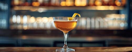 A Refreshing Cocktail on a Bar Counter With a Lemon Twist photo