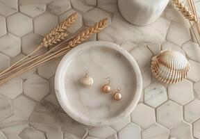 Gold Round Diamond Stud Earrings on White Marble Tray With Seashell and Wheat photo