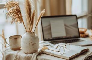 A Cozy Workspace With Dried Pampas Grass and an Open Notebook photo