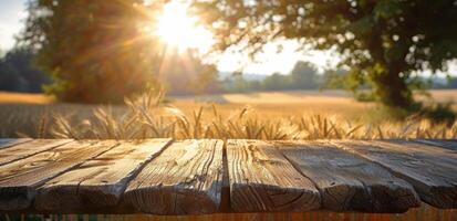 Wooden Plank Surface With Golden Wheat Field and Sunset in Background photo